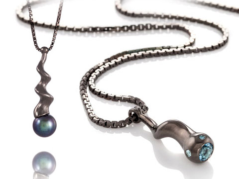 black designer pendant with black pearl and blue gems